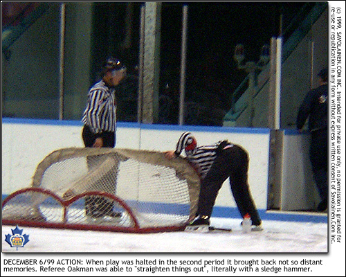 Referee Scott Oakman makes repairs